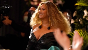 Beyonce appears in the audience before accepting the award for best rap song for "Savage" at the 63rd annual Grammy Awards at the Los Angeles Convention Center on Sunday, March 14, 2021. (AP Photo/Chris Pizzello) 