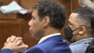 Eric Holder, right, looks on, while seated beside his attorney Aaron Jensen, during closing arguments at his trial on Thursday, June 30, 2022, in Los Angeles. (Frederic J. Brown/Pool Photo via AP)