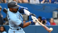 Toronto Blue Jays' Teoscar Hernandez hits a double off Tampa Bay Rays' Ryan Yarbrough in fourth inning American League baseball action in Toronto on Thursday, June 30, 2022. THE CANADIAN PRESS/Jon Blacker