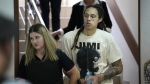 WNBA star and two-time Olympic gold medalist Brittney Griner is escorted to a courtroom for a hearing, in Khimki just outside Moscow, Russia, Friday, July 1, 2022. U.S. basketball star Brittney Griner is set to go on trial in a Moscow-area court Friday. The proceedings that are scheduled to begin Friday come about 4 1/2 months after she was arrested on cannabis possession charges at an airport while traveling to play for a Russian team. (AP Photo/Alexander Zemlianichenko)