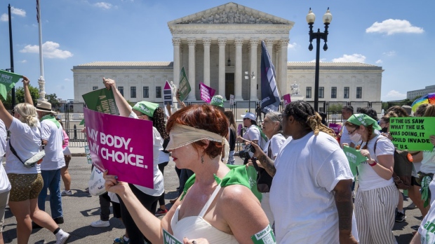 Mahayana Landowne, of Brooklyn, N.Y., wears a "Lady Justice" costume as she marches past the Supreme Court during a protest for abortion-rights, Thursday, June 30, 2022, in Washington. (AP Photo/Jacquelyn Martin)