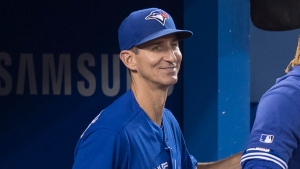 First base coach Mark Budzinski is seen in in the sixth inning of their American League MLB baseball game against the Tampa Bay Rays in Toronto Saturday September 28, 2019. THE CANADIAN PRESS/Fred Thornhill 