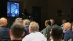 Akron Police body camera video showing the car chase involving Jayland Walker is presented during a news conference at the Firestone Park Community Center on Sunday, July 3, 2022, in Akron, Ohio. Walker was unarmed when Akron police chased him on foot and killed him in a hail of bullets, but officers believed he had shot at them earlier from a vehicle and feared he was preparing to fire again, authorities said. (Karen Schiely/Akron Beacon Journal via AP)