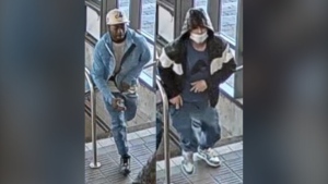 Police are looking for the two men seen in the photo in connection with an assault and robbery investigation. (Toronto Police Service)