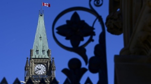 The Canadian flag on the Peace Tower flies at half-mast on Parliament Hill in Ottawa on Wednesday, June 2, 2021, in recognition of the discovery of children's remains at the site of a former residential school in Kamloops, B.C. The Canadian government, Assembly of First Nations and plaintiffs in two class-action lawsuits have signed a $20-billion final settlement agreement to compensate First Nations children and families harmed by chronic underfunding of child welfare and the government's narrow definition of Jordan's Principle. THE CANADIAN PRESS/Sean Kilpatrick
