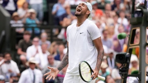 Australia's Nick Kyrgios reacts after winning a point against Brandon Nakashima of the US in a men's singles fourth round match on day eight of the Wimbledon tennis championships in London, Monday, July 4, 2022. (AP Photo/Alberto Pezzali)