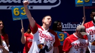 Joey Chestnut reacts after winning the Nathan's Famous Fourth of July hot dog eating contest in Coney Island on Monday, July 4, 2022, in New York. Chestnut at 63 hotdogs to win the men's division of the contest. (AP Photo/Julia Nikhinson)