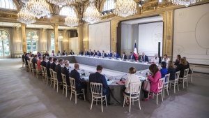 French President Emmanuel Macron, center at right, chairs the first cabinet meeting with new ministers at the Elysee Palace in Paris, Monday, July 4, 2022. French President Emmanuel Macron rearranged his Cabinet on Monday in an attempt to adjust to a new political reality following legislative elections in which his centrist alliance failed to win a majority in the parliament. (Christophe Petit Tesson, Pool via AP)