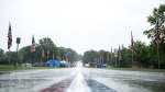 Rain pours down after the 4thFest parade was canceled due to severe weather on Independence Day, Monday, July 4, 2022, in Coralville, Iowa. (Joseph Cress/Iowa City Press-Citizen via AP)
