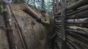 Ukrainian servicemen strengthen trenches on their position near the frontline in Kharkiv region, Ukraine, Tuesday, July, 5, 2022. (AP Photo/Andrii Marienko)