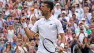 Serbia's Novak Djokovic celebrates after beating Italy's Jannik Sinner in a men's singles quarterfinal match on day nine of the Wimbledon tennis championships in London, Tuesday, July 5, 2022. (AP Photo/Alastair Grant)