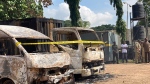 Burnt out cars are seen outside the Kuje maximum prison following a rebel attack in Kuje, Nigeria, Wednesday, July 6, 2022. At least 600 inmates escaped in a jailbreak in Nigeria's capital city, officials said Wednesday, blaming the attack on Islamic extremist rebels. About 300 have been recaptured, authorities said. (AP Photo/Chinedu Asadu)