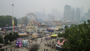 Visitors to the Stampede had to cope an Air Quality Health Index (AQHI) of ten with wildfire smoke blowing into Calgary on Sunday, July 18, 2021. The Calgary Stampede is raring to go Friday in its first return to full capacity since the start of the COVID-19 pandemic. THE CANADIAN PRESS/Jeff McIntosh