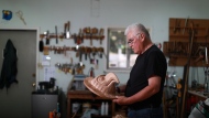 First Nations artist Richard Hunt began carving at the age of 13 now at 71 he continues to hone his skills as he works on his latest piece the Sun Mask using red cedar to create his one of a kind artwork at his studio in Victoria, B.C., on Thursday, June 30, 2022 THE CANADIAN PRESS/Chad Hipolito