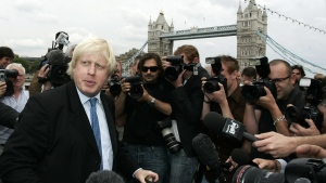 FILE - Britain Conservative Party MP, Boris Johnson, left, speaks to the media to launch his campaign as a candidate to be the Mayor of London, outside City Hall in central London, Monday, July 16, 2007. British media say Prime Minister Boris Johnson has agreed to resign on Thursday, July 7 2022, ending an unprecedented political crisis over his future. (AP Photo/Sang Tan, File)