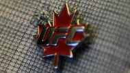 A pin with the Ultimate Fighting Championship logo and a maple leaf is displayed on Parliament Hill in Ottawa on Thursday, Sept. 29, 2011. THE CANADIAN PRESS/Sean Kilpatrick