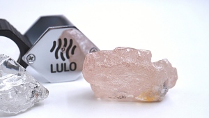 This photo supplied by Lucapa Diamond Company on Wednesday, July 27, 2022, shows the 170 carat pink diamond, right, recovered from Lulo, Angola. A big pink diamond of 170 carats has been discovered in Angola and is claimed to be the largest such gemstone found in 300 years. Called the “Lulo Rose,” the diamond was found at the Lulo alluvial diamond mine. The mine’s owner, the Lucapa Diamond Company, on Wednesday announced the discovery of the large pink diamond on its website. (Lucapa Diamond Company via AP)