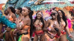 Participants dance to music prior to the start of the Caribbean Carnival's grand parade in Toronto, on Saturday, July 30, 2022. The parade returned to the city after a two-year hiatus as a result of the COVID-19 pandemic. THE CANADIAN PRESS/ Tijana Martin