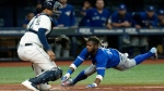 Toronto Blue Jays' Raimel Tapia scores in front of Tampa Bay Rays catcher Christian Bethancourt on a two-run single by Danny Jansen during the ninth inning of a baseball game Tuesday, Aug. 2, 2022, in St. Petersburg, Fla. (AP Photo/Chris O'Meara)