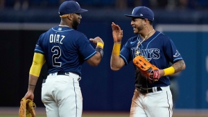 Tampa Bay Rays center fielder Jose Siri celebrates with third baseman Yandy Diaz (2) after the team defeated the Toronto Blue Jays during a baseball game Wednesday, Aug. 3, 2022, in St. Petersburg, Fla. (AP Photo/Chris O'Meara)