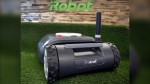 This Wednesday, Jan. 16, 2019 file photo shows an iRobot Terra lawn mower in Bedford, Mass. Amazon on Friday, Aug. 5, 2022, announced it has entered into an agreement to acquire the iRobot for approximately $1.66 billion. The company sells its robots worldwide and is most famous for the circular-shaped Roomba vacuum. (AP Photo/Elise Amendola, File)