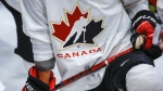 A Hockey Canada logo is shown on the jersey of a player with Canada’s National Junior Team during a training camp practice in Calgary, Tuesday, Aug. 2, 2022.THE CANADIAN PRESS/Jeff McIntosh