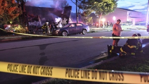 Firefighters set up lights in front of a fatal house fire at 733 First Street in Nescopeck, Pa, Friday, Aug. 5, 2022. The fire in Nescopeck was reported around 2:30 a.m. The cause of the fire remains under investigation. (Jimmy May/Bloomsburg Press Enterprise via AP)