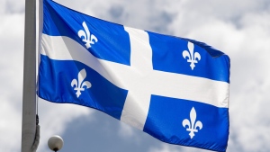 Quebec's provincial flag flies on a flag pole in Ottawa, Friday July 3, 2020. THE CANADIAN PRESS/Adrian Wyld