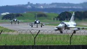 Taiwan Air Force Mirage fighter jets taxi on a runway at an airbase in Hsinchu, Taiwan, Friday, Aug. 5, 2022. China says it summoned European diplomats in the country to protest statements issued by the Group of Seven nations and the European Union criticizing threatening Chinese military exercises surrounding Taiwan. (AP Photo/Johnson Lai)