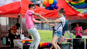 Florence, left, and Billie dance at the site where the Montreal Pride parade was supposed to start from in Montreal, Sunday, August 7, 2022. Festival organizers cancelled the parade over concerns for security due to the lack of staff. THE CANADIAN PRESS/Graham Hughes