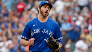 Toronto Blue Jays relief pitcher Jordan Romano celebrates the win over the Minnesota Twins at a baseball game Sunday, Aug. 7, 2022, in Minneapolis. The Blue Jays won 3-2 in 10 innings. (AP Photo/Bruce Kluckhohn)