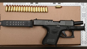 A Glock 26 9mm pistol loaded with 18 rounds of ammunition seen in this photo was allegedly recovered from a man while he was being arrested for assault. (Toronto Police Service)