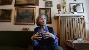 FILE - Zofia Posmysz, a 96-year-old Polish Catholic woman who survived the Nazi German concentration camps of Auschwitz and Ravensbrueck, poses at her home in Warsaw, Poland, Tuesday, Jan. 14, 2020. Posmysz, who later became a journalist and author of the novels including “The Passenger,” died Monday, Aug. 8, 2022, according to the Auschwitz-Birkenau state memorial museum. She was 98. (AP Photo/Czarek Sokolowski, File)