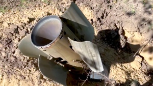 In this handout photo taken from video and released by Russian Defense Ministry Press Service on Sunday, Aug. 7, 2022, A rocket fragment after shelling is seen near the Zaporizhzhia Nuclear Power Station in territory under Russian military control, southeastern Ukraine. The Russian military said that Ukrainian shelling of the Zaporizhzhia nuclear plant on Sunday caused a power surge and fire and forced staff to lower output from two reactors. (Russian Defense Ministry Press Service via AP)