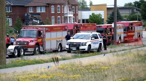 Emergency vehicles are pictured at the scene of a trench collapse in Ajax Monday August 8, 2022. (Simon Sheehan /CP24)