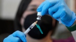 A registered nurse prepares a dose of a Monkeypox vaccine at the Salt Lake County Health Department Thursday, July 28, 2022, in Salt Lake City.  (AP Photo/Rick Bowmer, File)
