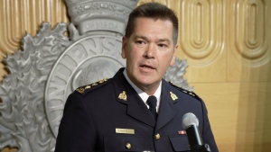 Chief Supt. Tyler Bates of the RCMP's South District Management Team speaks during a press conference in Regina on Tuesday, Aug. 9, 2022. RCMP say an arrest warrant has been issued for 50-year-old Benjamin Martin Moore, a convicted sex offender at the centre of an Amber Alert for two children. THE CANADIAN PRESS/Michael Bell
