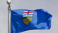 Alberta's provincial flag flies on a flag pole in Ottawa, Tuesday June 30, 2020. THE CANADIAN PRESS/Adrian Wyld
