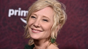 FILE - Anne Heche arrives at the premiere of "The Tender Bar" on Dec. 12, 2021, at the TCL Chinese Theatre in Los Angeles. Heche was in the hospital Saturday, Aug. 6, 2022, following an accident in which her car smashed into a house and flames erupted, a representative for the actor told People magazine. (Photo by Jordan Strauss/Invision/AP, File) 