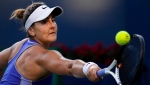 Bianca Andreescu, of Canada, returns the ball against Qinwen Zheng, of China, during the National Bank Open tennis tournament in Toronto on Thursday, August 11, 2022. THE CANADIAN PRESS/Nathan Denette
