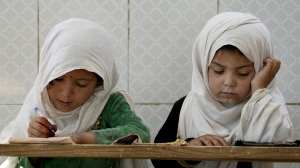 Afghan girls read the Quran in the Noor Mosque outside the city of Kabul, Afghanistan, Tuesday, Aug 9, 2022. Maulvi Bakhtullah, the head of the mosque, said that the number of girls who come to this mosque to learn Quran has multiplied after the closure of public schools. For most teenage girls in Afghanistan, it’s been a year since they set foot in a classroom. With no sign the ruling Taliban will allow them back to school, some girls and parents are trying to find ways to keep education from stalling for a generation of young women. (AP Photo/Ebrahim Noroozi)