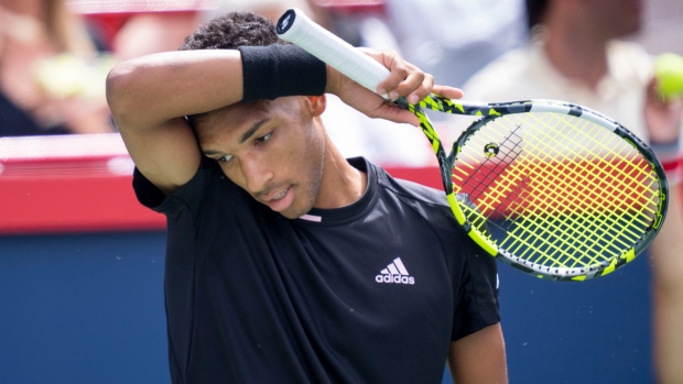 Felix Auger-Aliassime returns to Casper Ruud of Norway during quarterfinal play at the National Bank Open tennis tournament, Friday, August 12, 2022 in Montreal. THE CANADIAN PRESS/Paul Chiasson