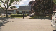 A police officer stands at the scene of a stabbing and shooting in Scarborough.