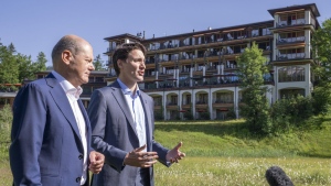 Prime Minister Justin Trudeau and Olaf Scholz, Chancellor of Germany stop to talk to the media as they take a stroll at the G7 Summit in Schloss Elmau on June 27, 2022. The Prime Minister's Office says Justin Trudeau will accompany the chancellor of Germany, Olaf Scholz, on a brief Canadian visit later this month that will include stops in Montreal, Toronto and Stephenville in western Newfoundland. In a statement released Saturday, the PMO confirmed the Aug. 21-23 visit starts in Montreal, where meetings will be held with German and Canadian business leaders, and a tour is scheduled at an artificial intelligence institute. THE CANADIAN PRESS/Paul Chiasson