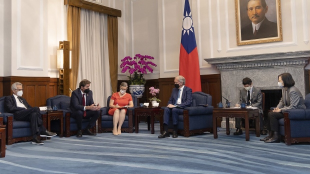 In this photo released by the Taiwan Presidential Office, Taiwan's President Tsai Ing-wen at right meets with U.S. Congress members including at left Democrat House member Alan Lowenthal from California, Democrat House members John Garamendi and U.S. Democrat Sen. Ed Markey of Massachusetts, fourth from left, during a meeting at the Presidential Office in Taipei, Taiwan on Monday, Aug. 15, 2022. The delegation of U.S. Congress members visited Taiwan parliament on Monday in a further sign of support among American lawmakers for the self-governing island. (Taiwan Presidential Office via AP)