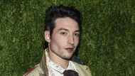 FILE - Ezra Miller attends the 15th annual CFDA/Vogue Fashion Fund event at the Brooklyn Navy Yard in New York, Nov. 5, 2018. According to a report from the Vermont State Police on Monday, Aug. 8, 2022, Miller has been charged with felony burglary in Stamford, Vt., the latest in a string of recent incidents involving the embattled star of “The Flash.” (Photo by Evan Agostini/Invision/AP, File)
