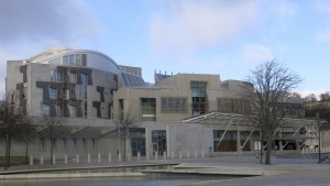 FILE - This file photo taken March 16, 2014 shows a general view of the Scottish Parliament in Edinburgh, Scotland. A law has come into force in Scotland to ensure period products are available free of charge to anyone who needs them. The Scottish government said it became the first in the world to legally protect the right to access free period products when its Period Products Act came into force Monday. (AP Photo/Jill Lawless, File)