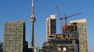 A new report says the total value of commercial real estate sales in the Greater Toronto Area in the second quarter rose 43 per cent compared with a year ago. Construction cranes feature on the skyline in Toronto on Wednesday, July 5, 2017. THE CANADIAN PRESS/Frank Gunn