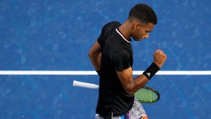 Felix Auger-Aliassime, of Canada, reacts in a match against Jannik Sinner, of Italy, during the Western & Southern Open tennis tournament Thursday, Aug. 18, 2022, in Mason, Ohio. (AP Photo/Jeff Dean)
