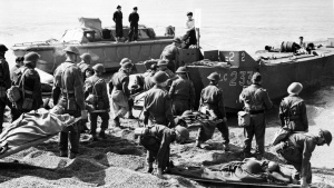 Members of the Royal Canadian Medical Corps evacuate Allied soldiers from the beach after the Dieppe, France, raid during the Second World War. THE CANADIAN PRESS
